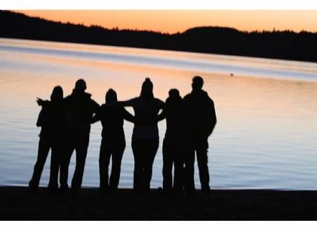 Family medicine resident silhouettes at lakeside